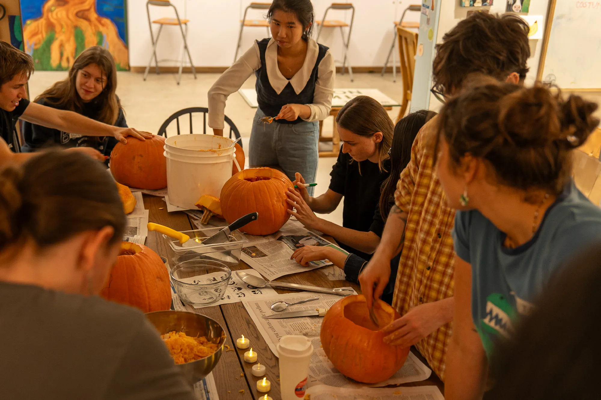 participants carving pumpkins