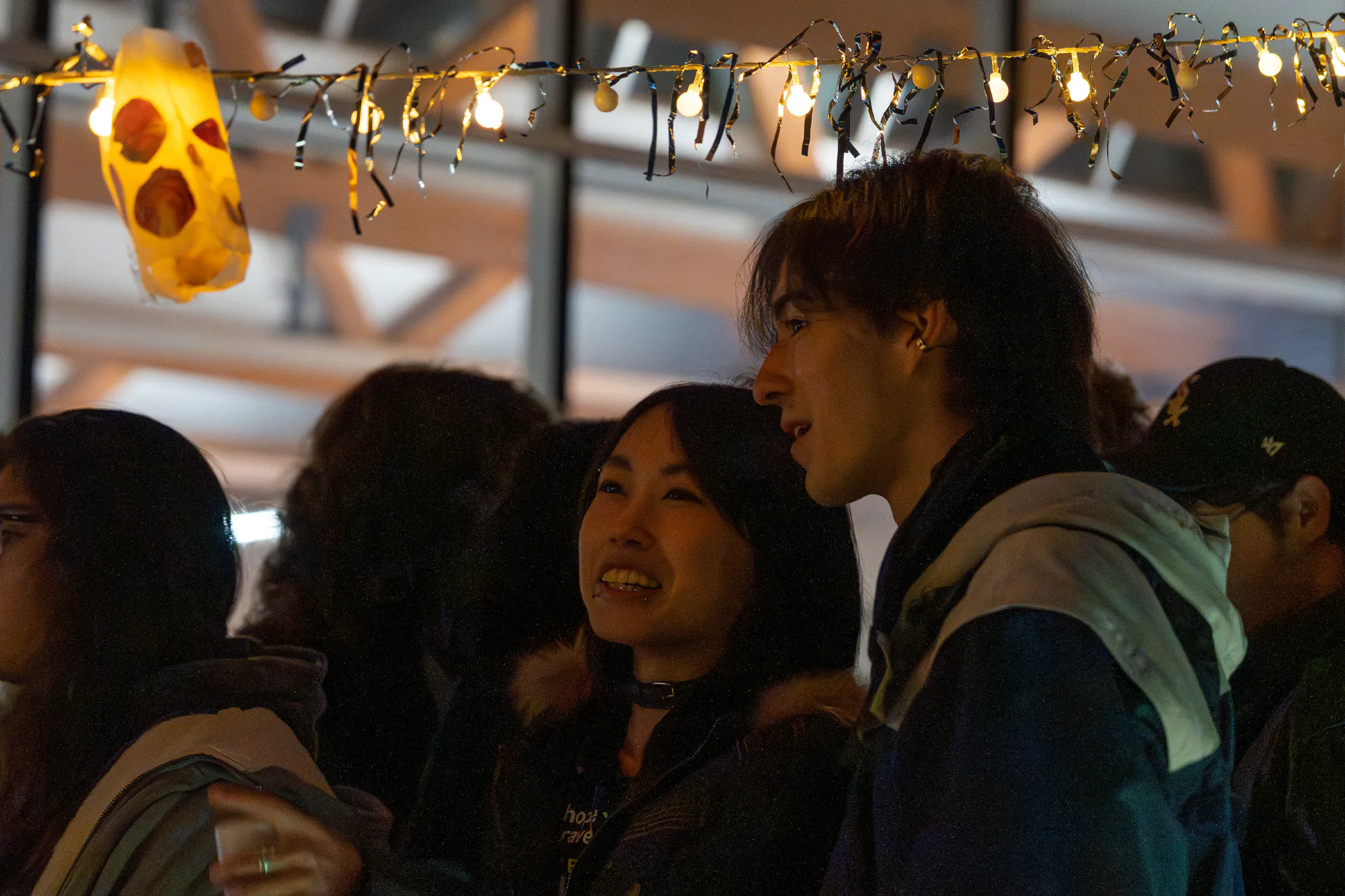 people under handmade lanterns