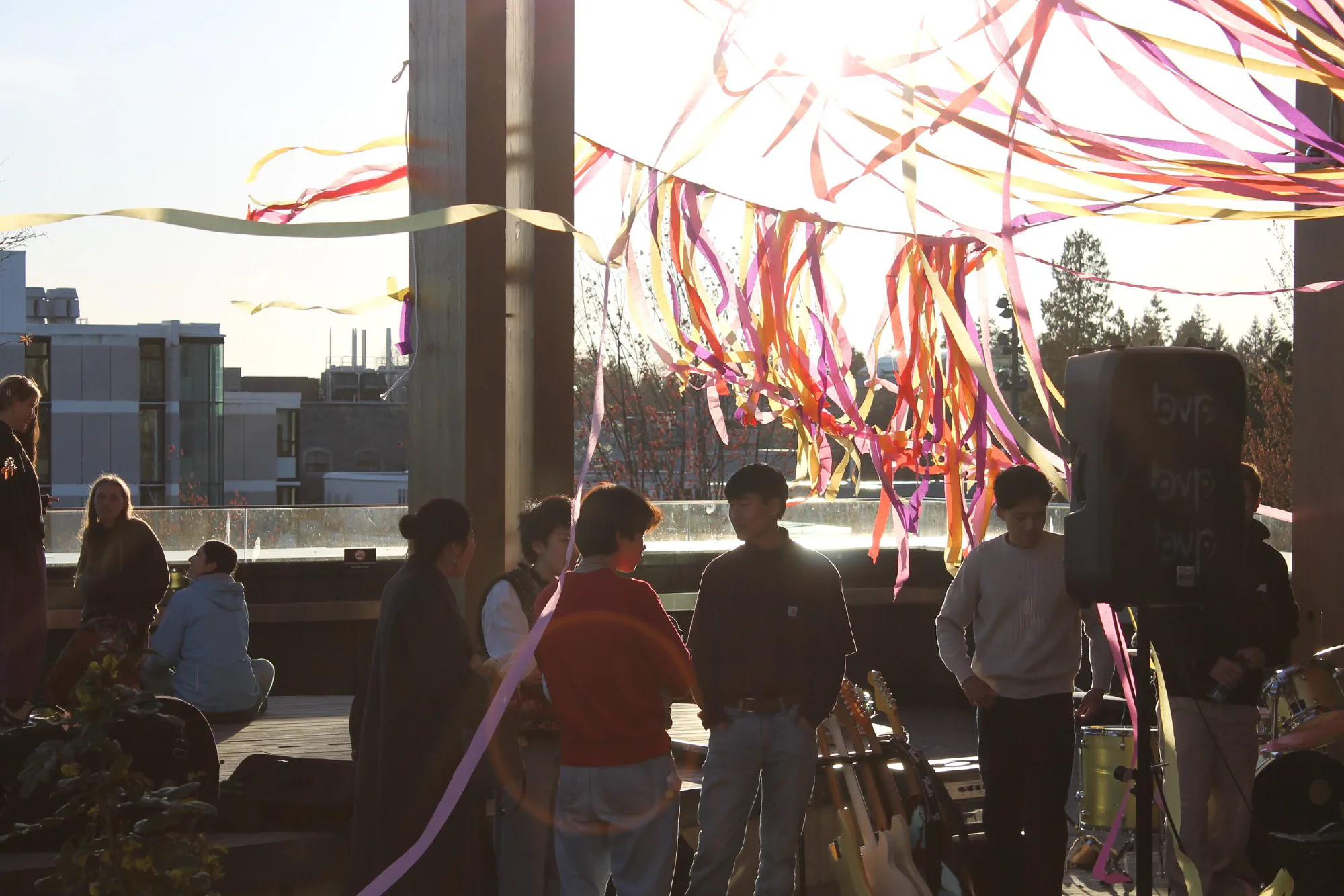 crowd under streamers at Sunset on the Roof